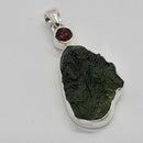 Pendant, Moldavite Freeform Wrapped SS + Faceted Garnet
